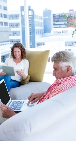 mature-man-with-notebook-while-sitting-by-woman